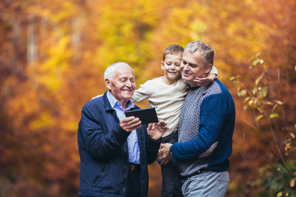 Three generations enjoying fall foliage.